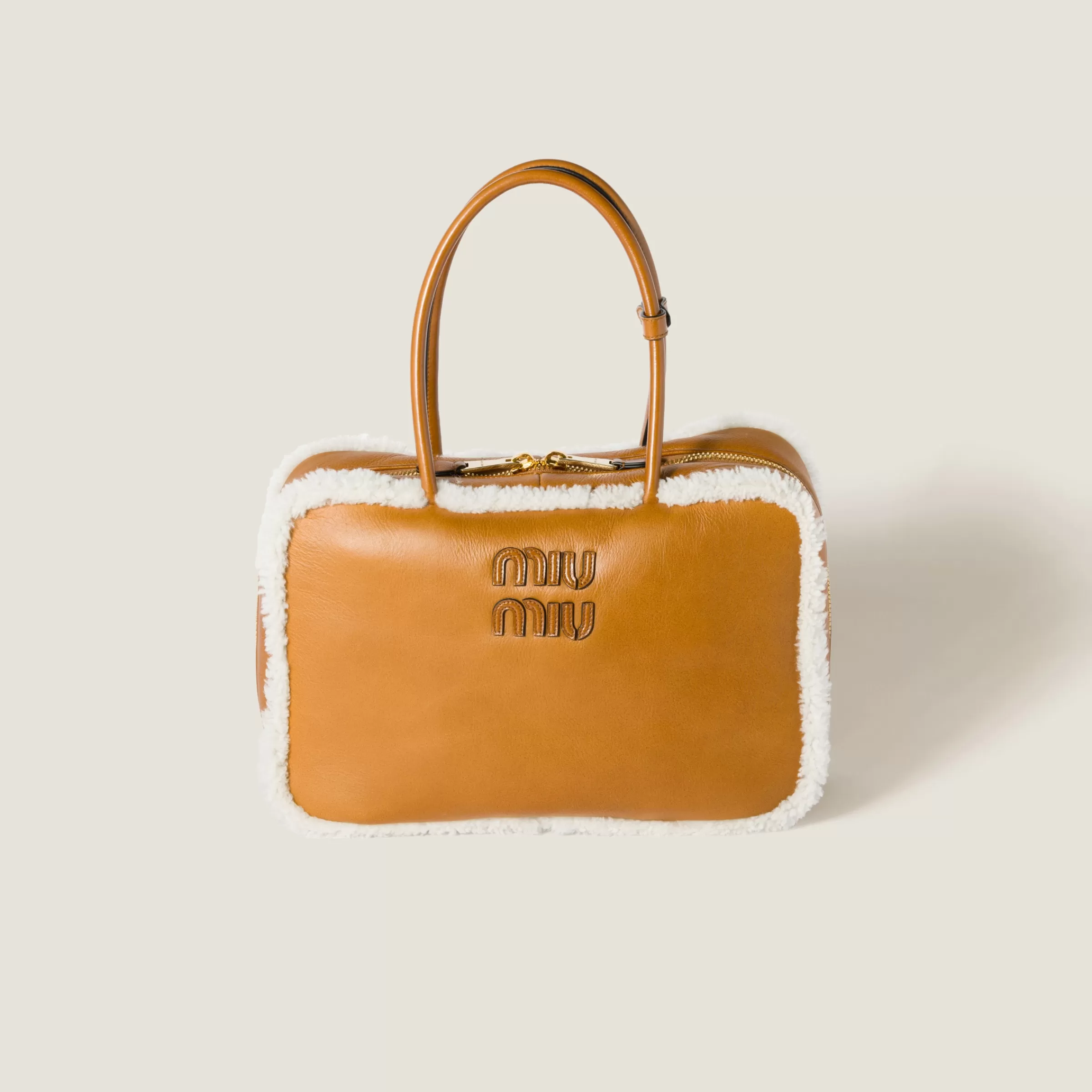 Beau shearling top-handle bag>Miu Miu Shop