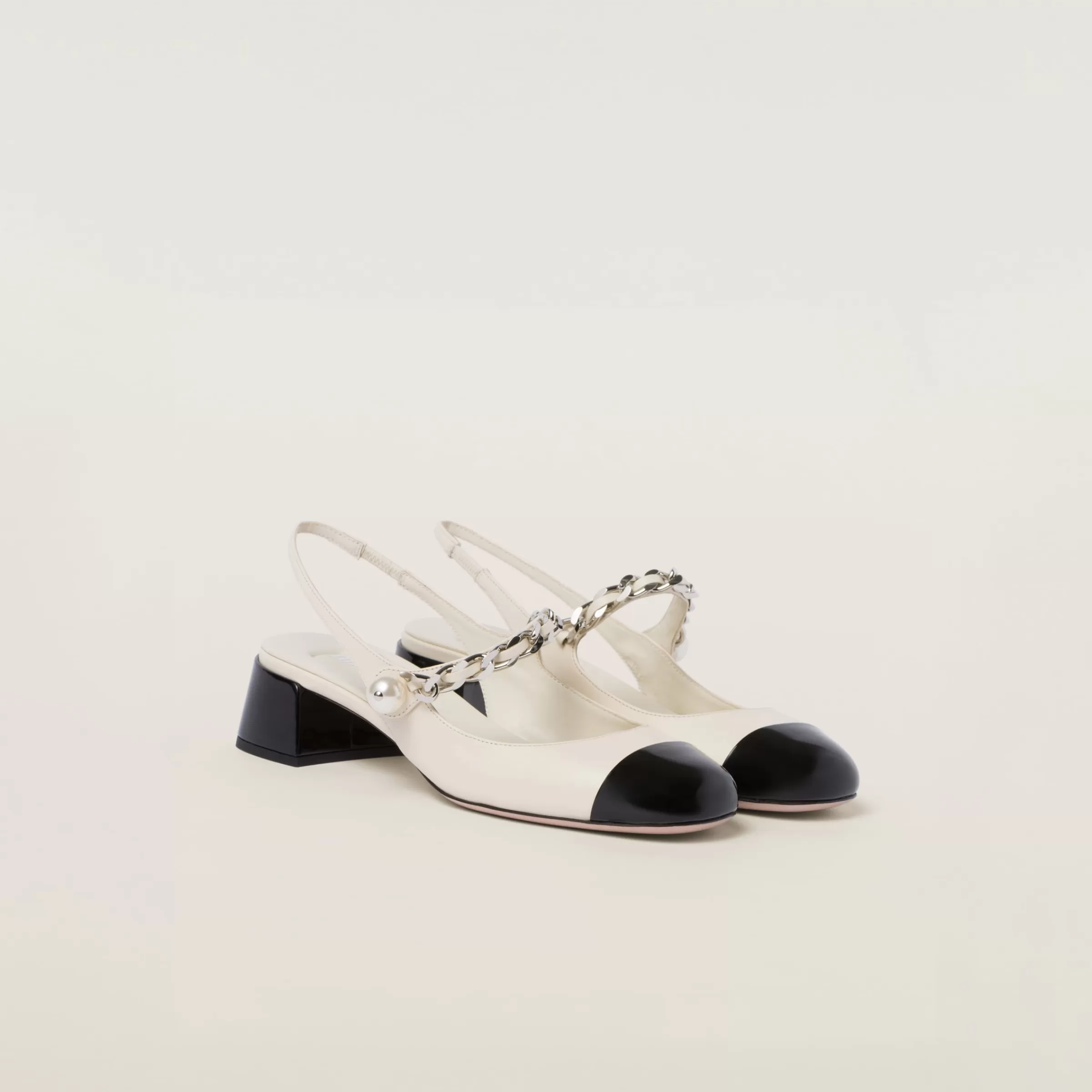 Leather and patent leather slingback pumps>Miu Miu Cheap